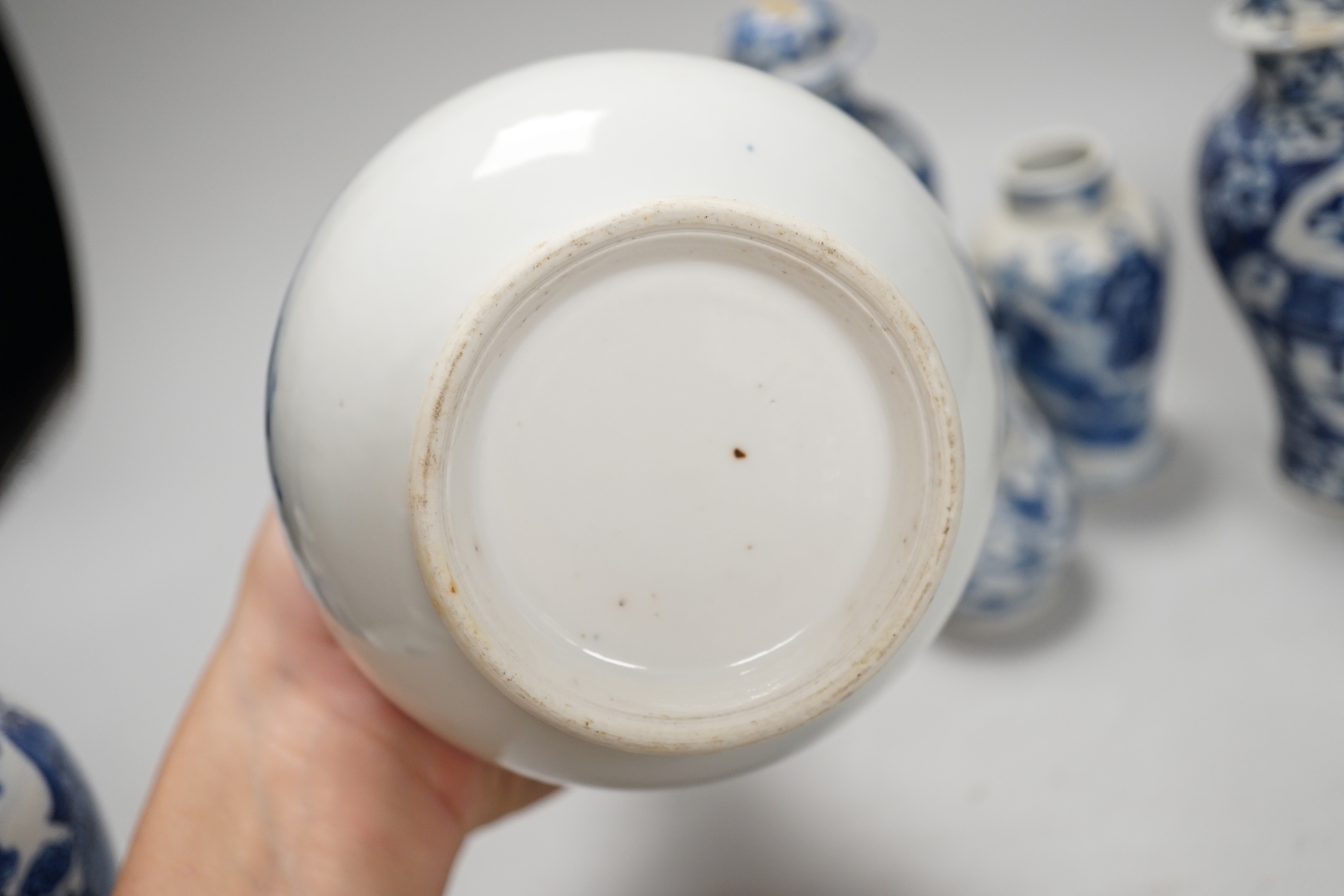 A Chinese armorial blue and white bottle vase, Qianlong/Jiaqing period, and five assorted 19th century Chinese blue and white vases, tallest 20cm; faults